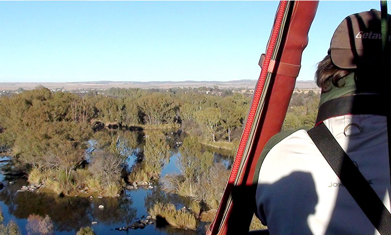 Blue skies and crystal clear waters of Parys viewed from above in a hot air balloon.