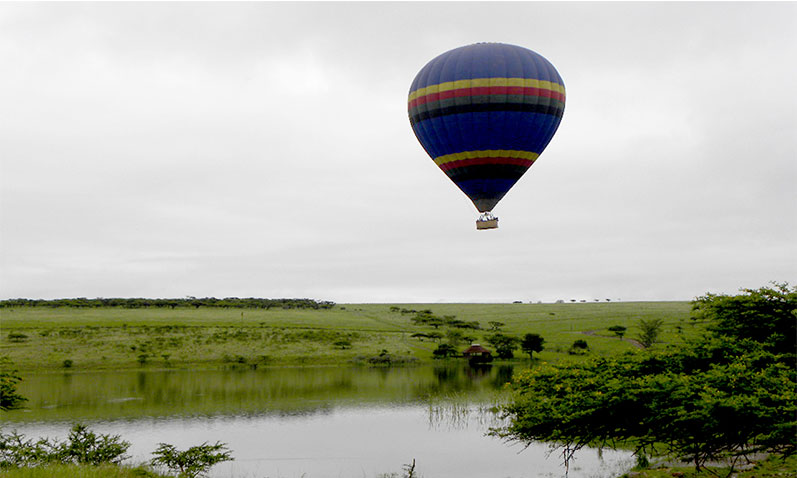 Floating gracefully over the Tala game reserve river in a hot air balloon.